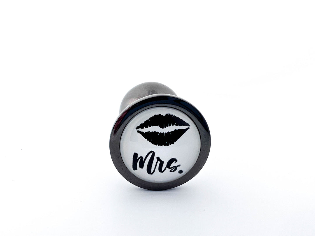 His or Hers Butt Plugs Featuring a Mustache or Sexy Lips Indulge His or Hers Butt Plugs Featuring a Mustache or Sexy Lips Indulge