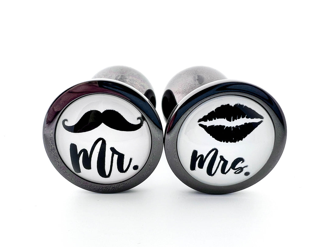 His or Hers Butt Plugs Featuring a Mustache or Sexy Lips Indulge His or Hers Butt Plugs Featuring a Mustache or Sexy Lips Indulge